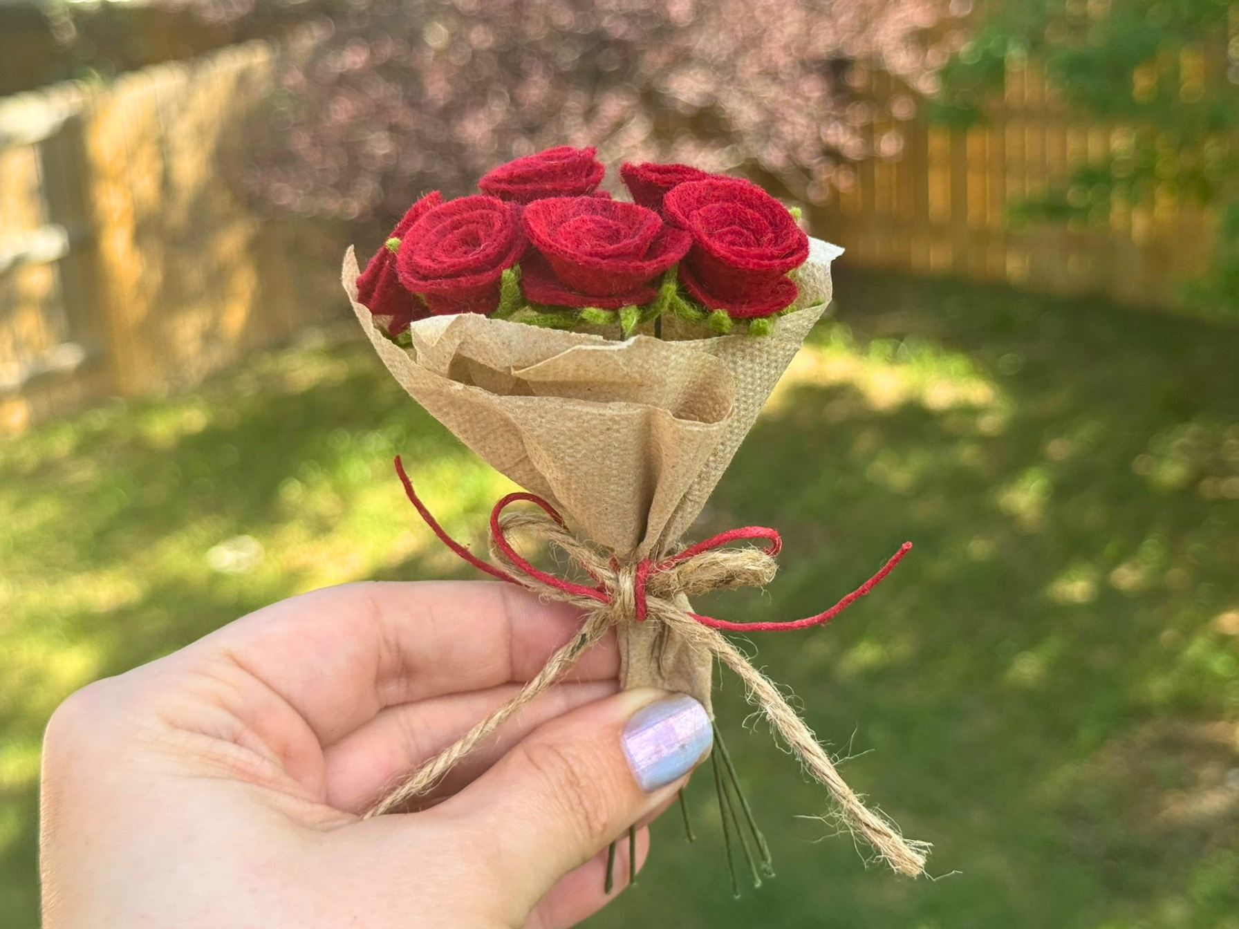 Mini felt rose bouquet wrapped in paper
