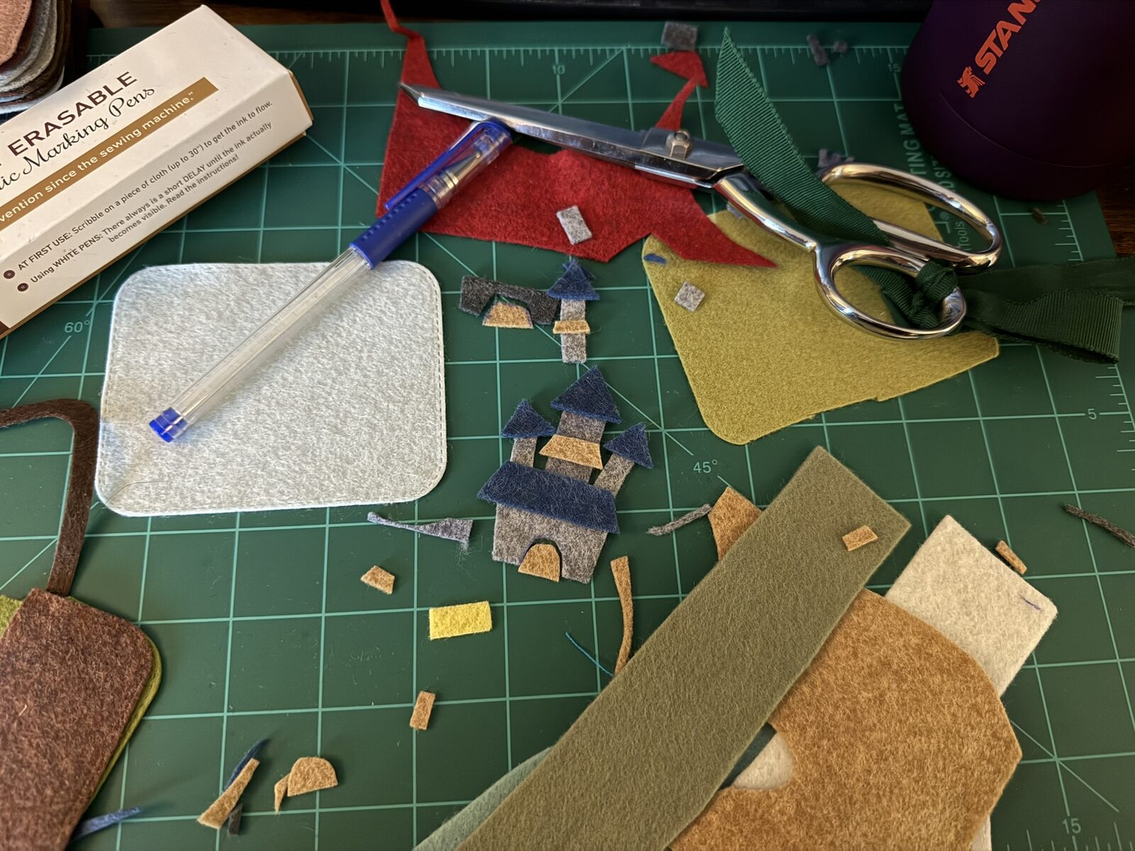 The beginnings of A Long Walk: felt scraps, scissors, and a blank base