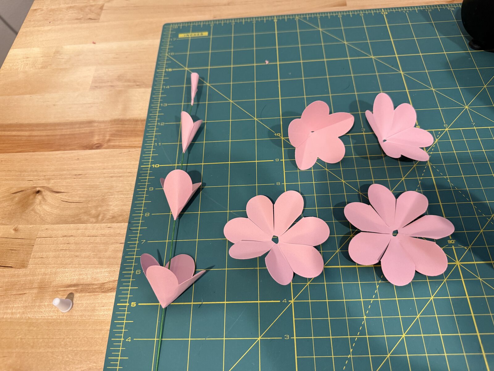 Glued petal groups getting stacked on wire.