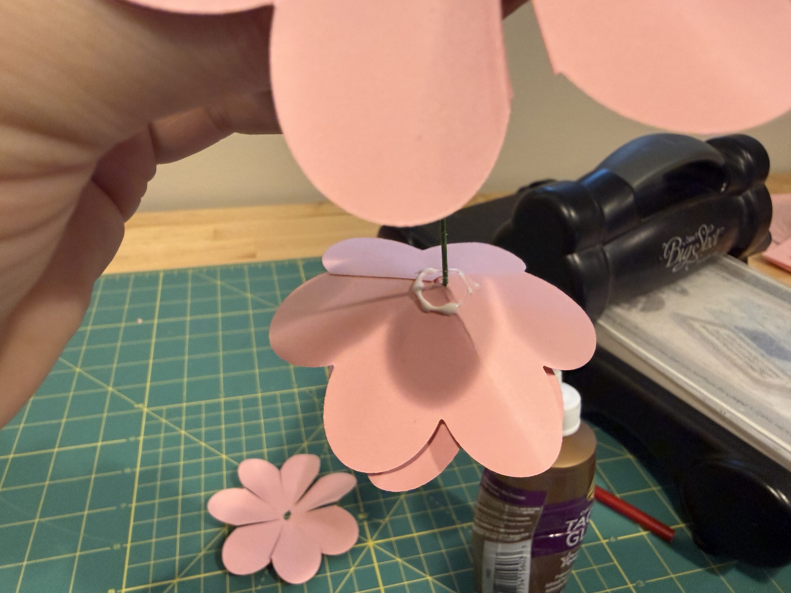 Generous ring of glue on bottom of paper rose.