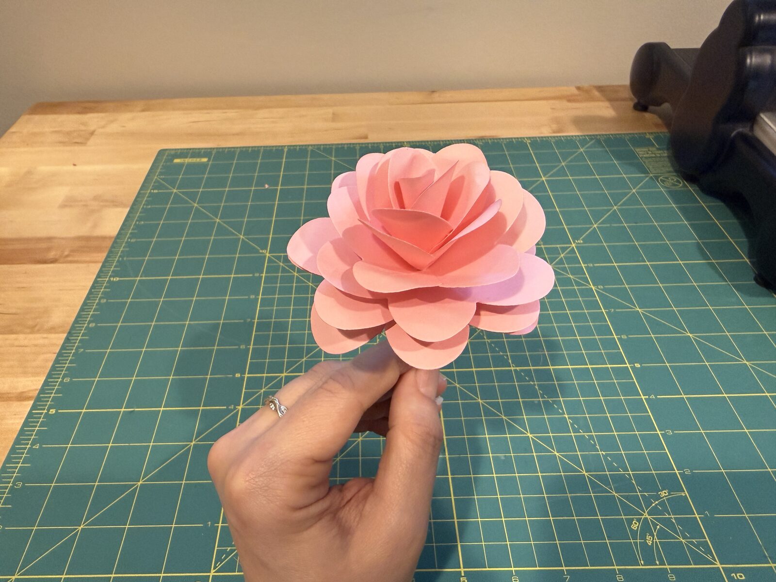 finished rose over green mat