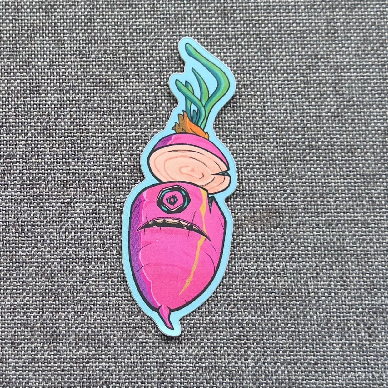Benny sticker: a tall pink radish with one spiral eye, a stitched frown, and curling green leaves, outlined in light blue