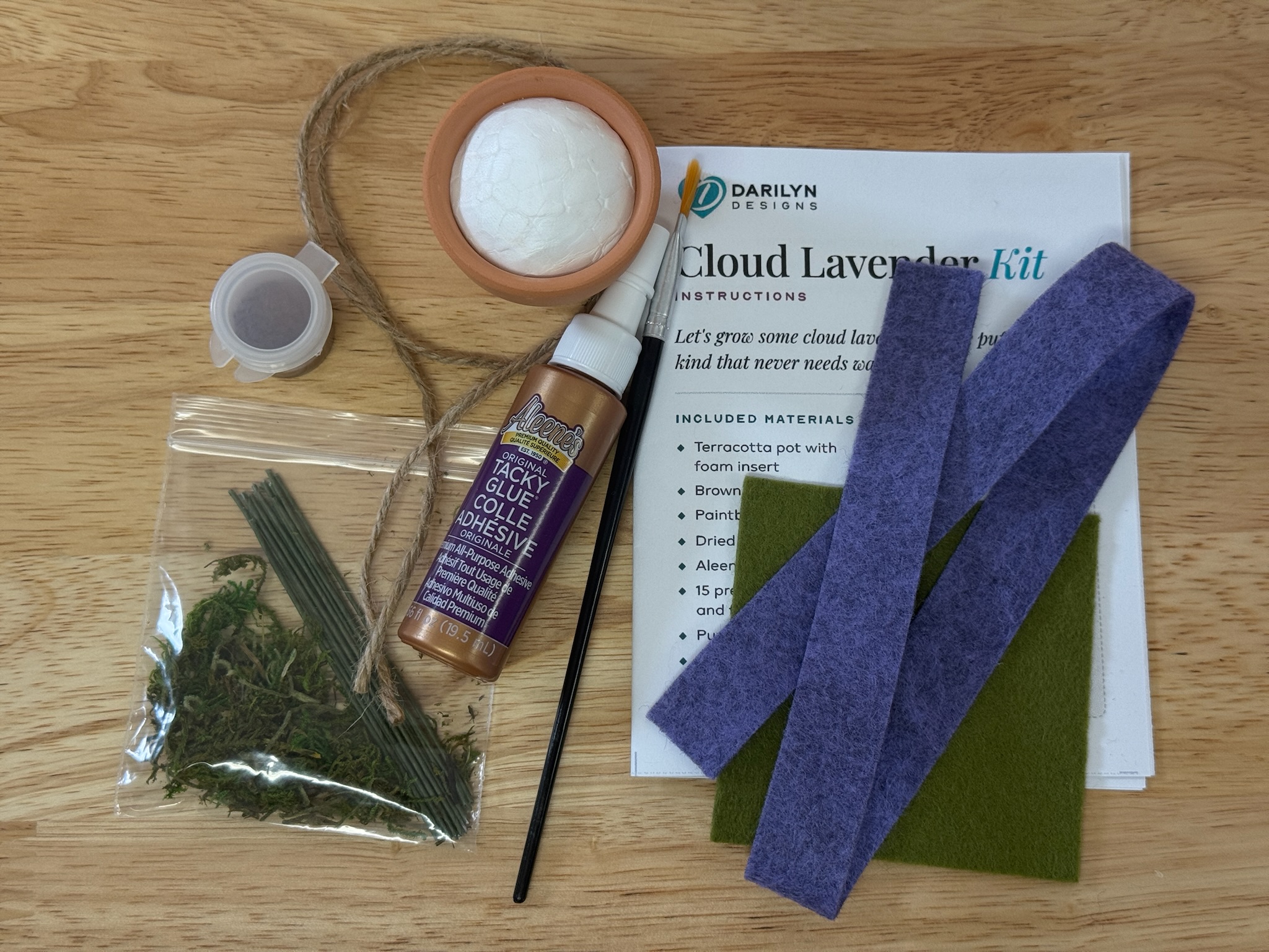 Everything included in the Cloud Lavender felt flower craft kit, laid out on a table