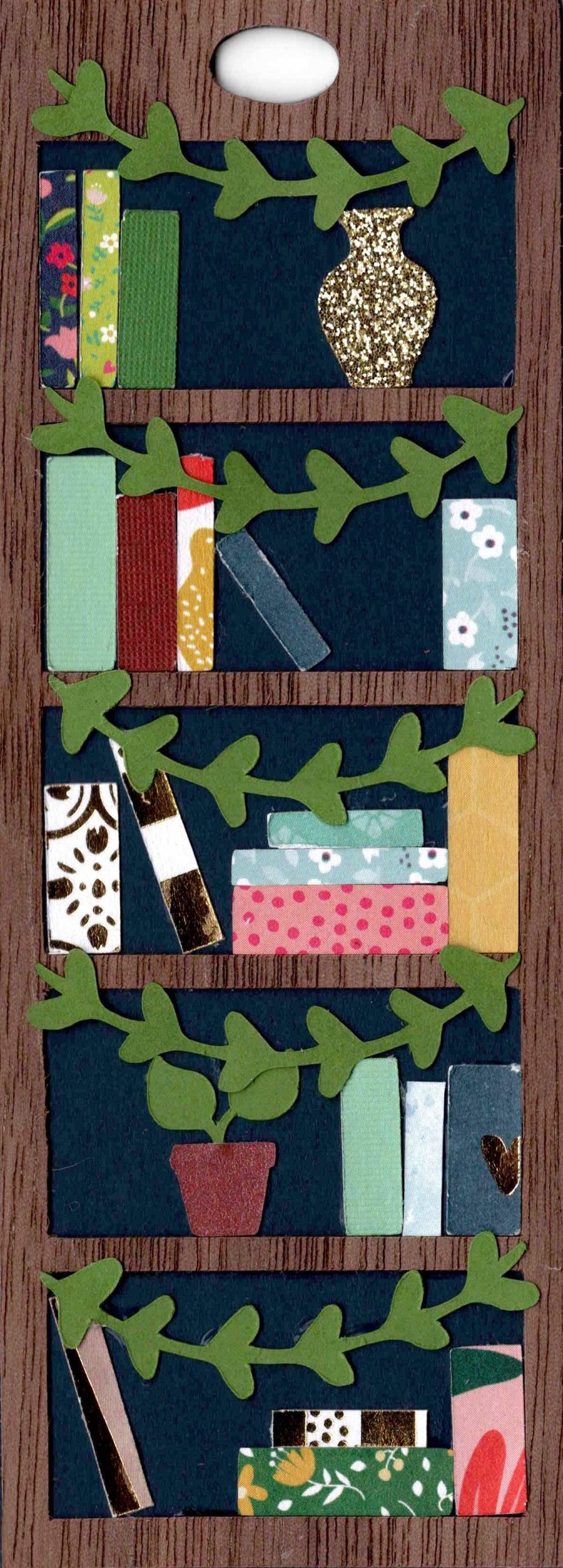 Mini Bookshelf Bookmark styled with green vines draping across every shelf, a potted plant, and a gold glitter vase