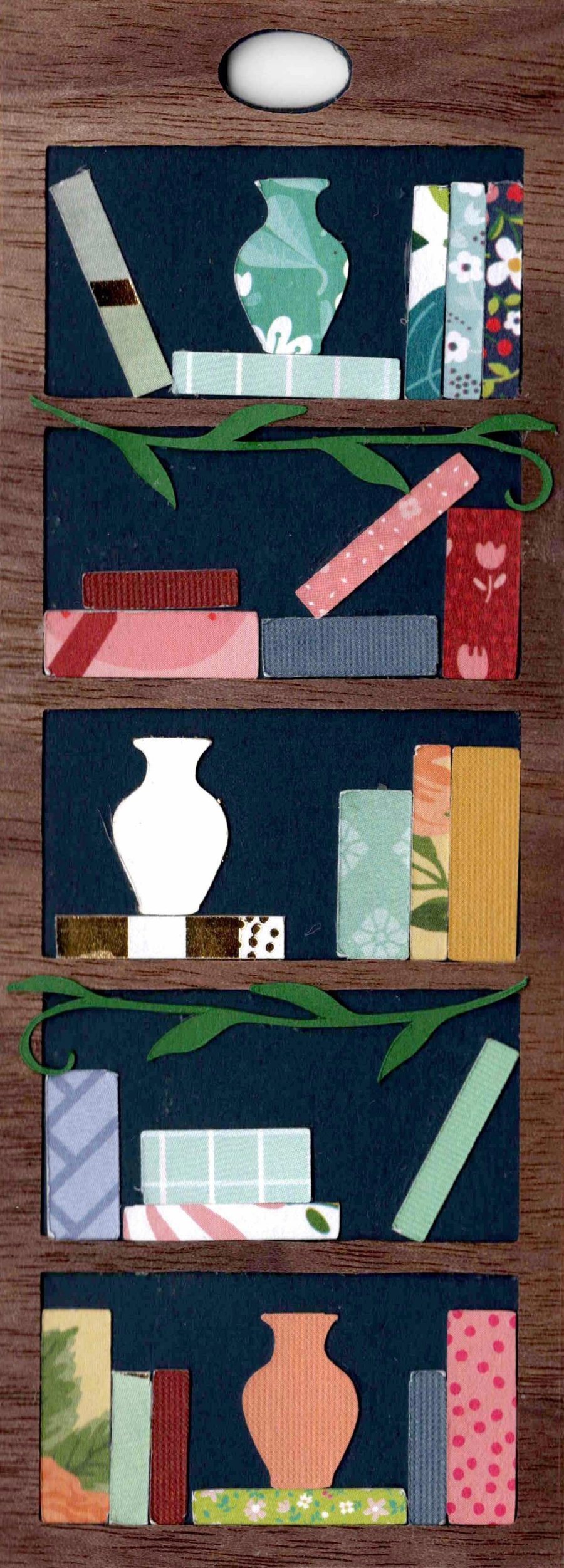 Mini Bookshelf Bookmark styled with a vase featured on nearly every shelf, leaning books, and deliberate open space
